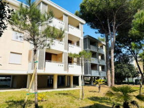 Flat in a building surrounded by a garden Bibione